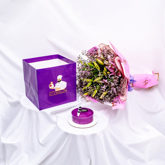 A luxury gift combo featuring a purple bento cake, a large pink flower bouquet, and a premium purple 'Let's Bake Cake' branded gift bag, available for same-day delivery in Abu Dhabi.