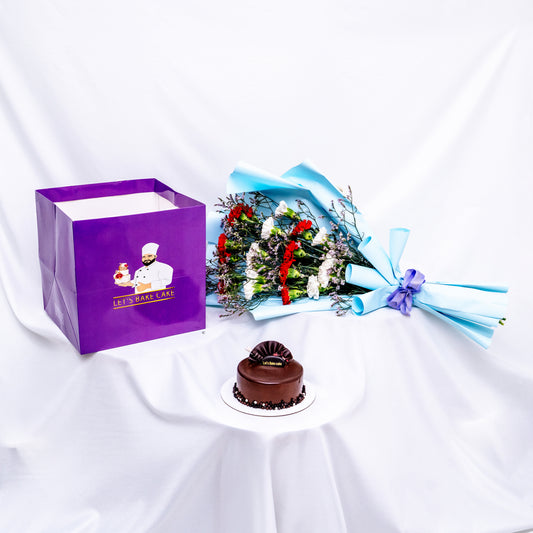 A premium gift set featuring a rich chocolate bento cake, a vibrant red and white flower bouquet in sky-blue wrap, and a signature 'Let's Bake Cake' purple gift bag on white silk, Abu Dhabi.
