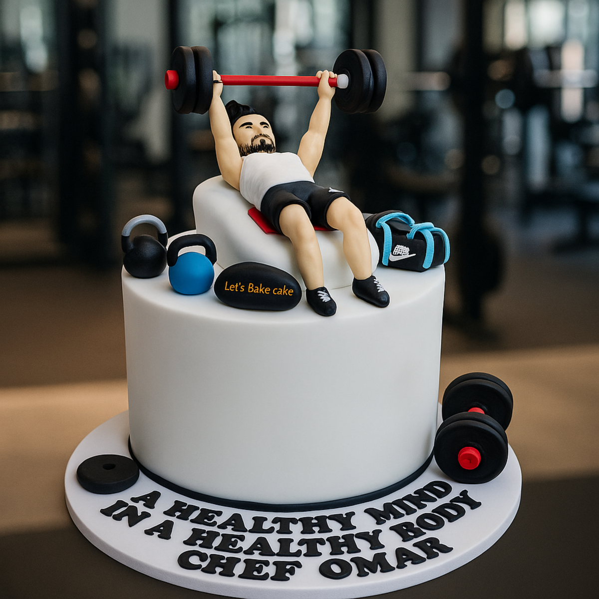 A white gym-themed birthday cake with a 3D man figurine bench pressing, edible kettlebells, and dumbbells by Let's Bake Cake Abu Dhabi.