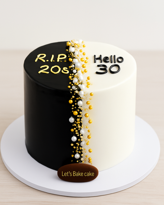 A luxury black and white split-themed 30th birthday cake with gold pearl detailing by Let's Bake Cake Abu Dhabi