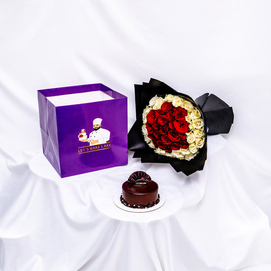 A luxury gift set featuring a rich chocolate glazed bento cake, a heart-shaped red and white rose bouquet in black premium wrap, and a branded 'Let's Bake Cake' purple gift bag, Abu Dhabi.