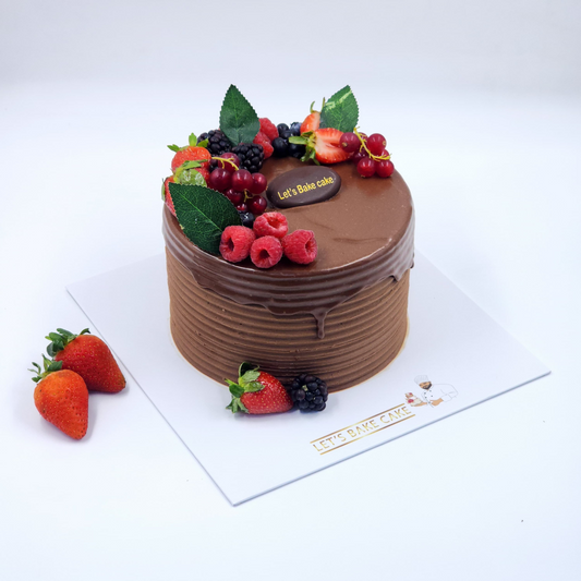A luxury chocolate cake with horizontal textured frosting, dark chocolate ganache drip, and fresh berries on top by Let's Bake Cake Abu Dhabi.