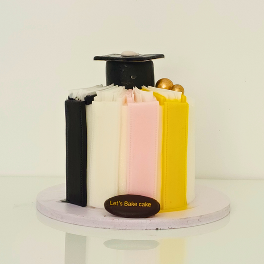 A luxury graduation cake designed to look like a stack of colorful books topped with a black graduation cap and gold spheres by Let's Bake Cake Abu Dhabi.
