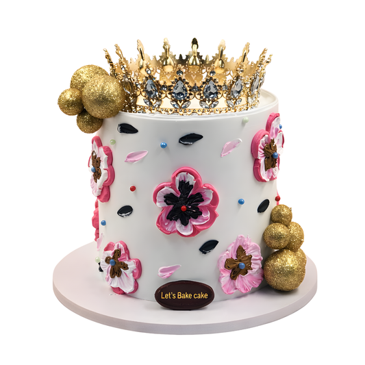 A premium white birthday cake featuring 3D palette knife floral art, golden glitter spheres, and a large crystal gold crown by Let's Bake Cake Abu Dhabi.