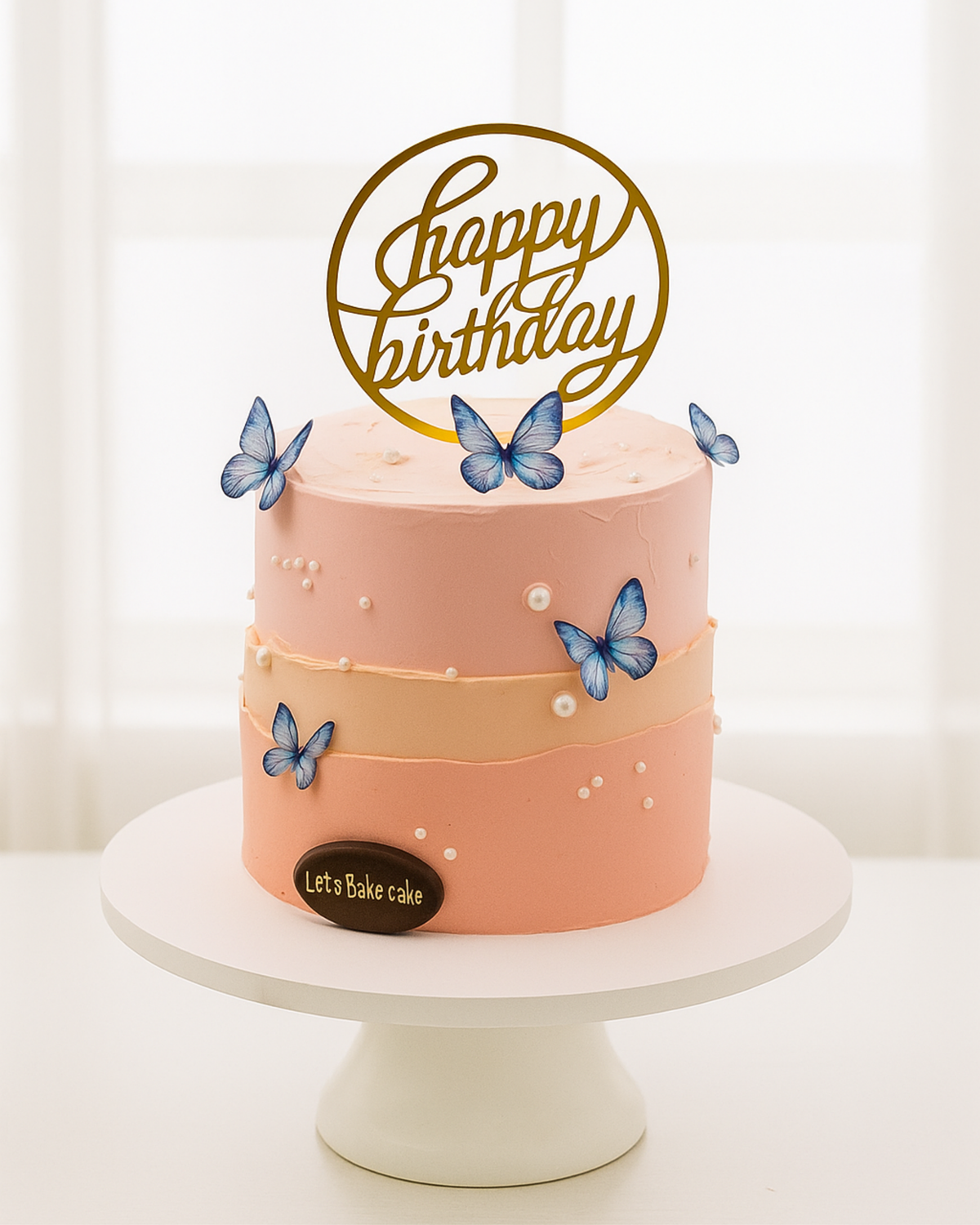 A luxury peach and pink ombré fault-line birthday cake with blue butterflies and golden pearls by Let's Bake Cake Abu Dhabi