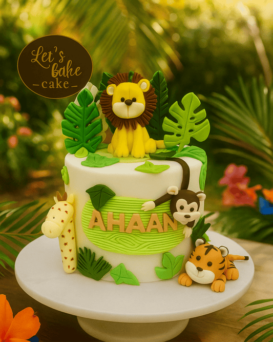 A luxury white safari-themed birthday cake with 3D lion, monkey, giraffe, and tiger toppers by Let's Bake Cake Abu Dhabi.