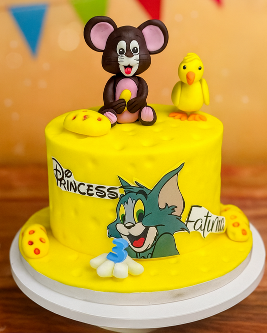 A luxury yellow Swiss cheese themed birthday cake with 3D Jerry the Mouse and duckling toppers by Let's Bake Cake Abu Dhabi.