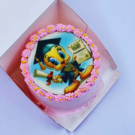 A luxury graduation cake with a Tweety Bird edible image, pink frosting swirls, and yellow sprinkles by Let's Bake Cake Abu Dhabi
