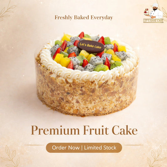 A luxury fresh fruit cake topped with dragon fruit, mango, kiwi, and strawberries, featuring a nutty crust and whipped cream border, by Let's Bake Cake Abu Dhabi